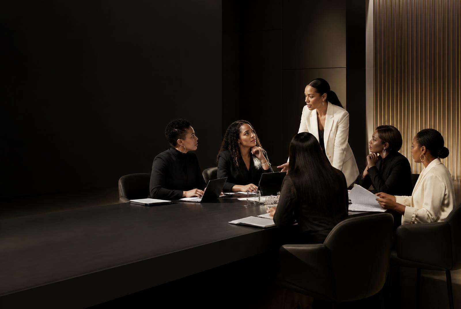 Women founders collaborating around a strategy table